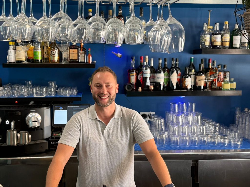 Piotr, owner of L'ONDA, behind the bar