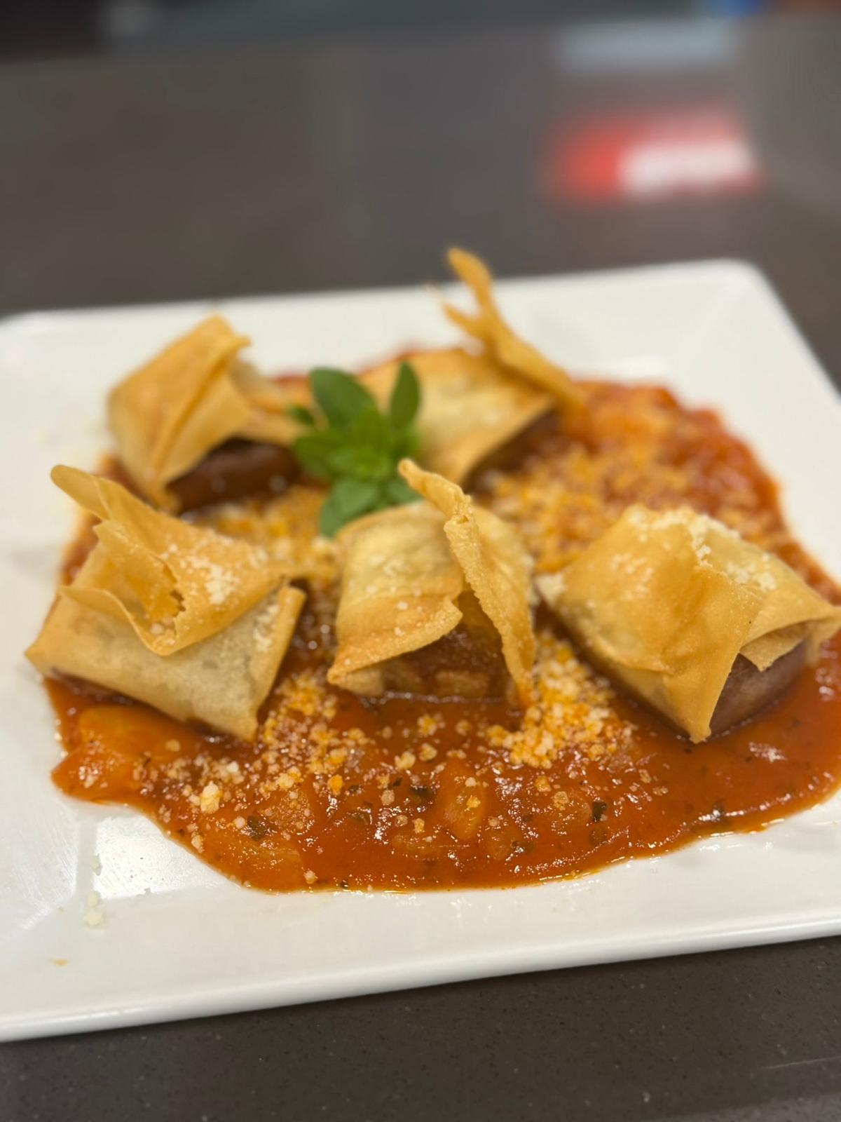 Crispy filo parcels in tomato sauce